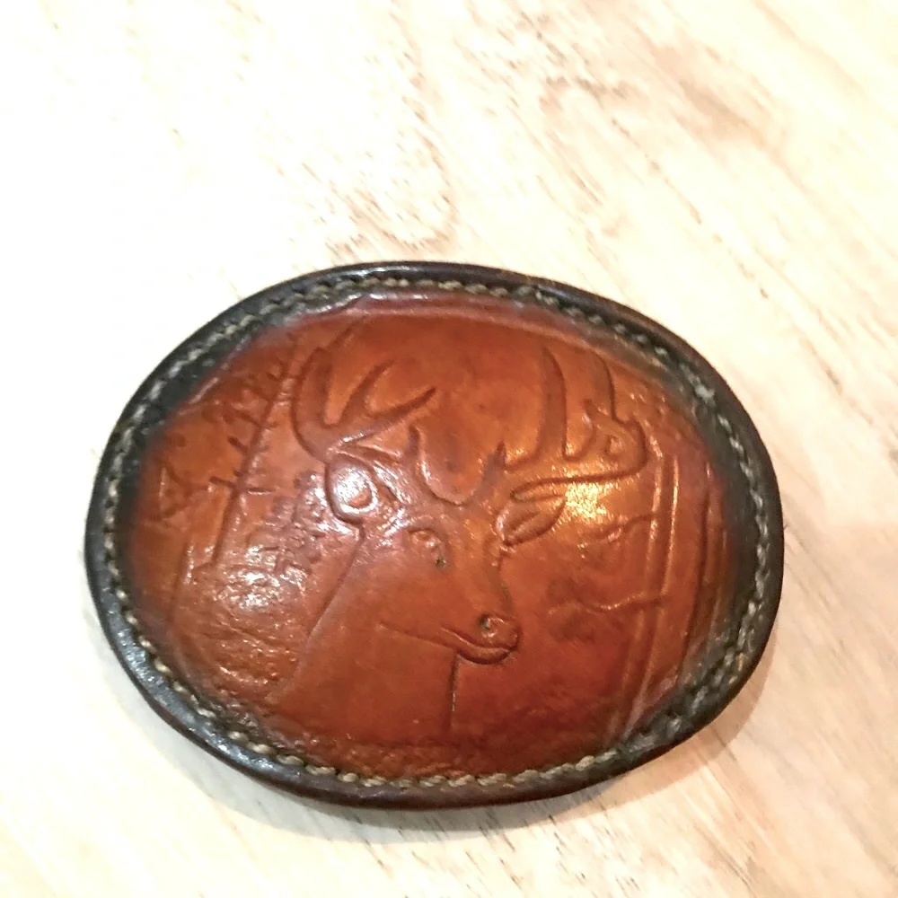 - Handcrafted leather seat belt buckle in brown